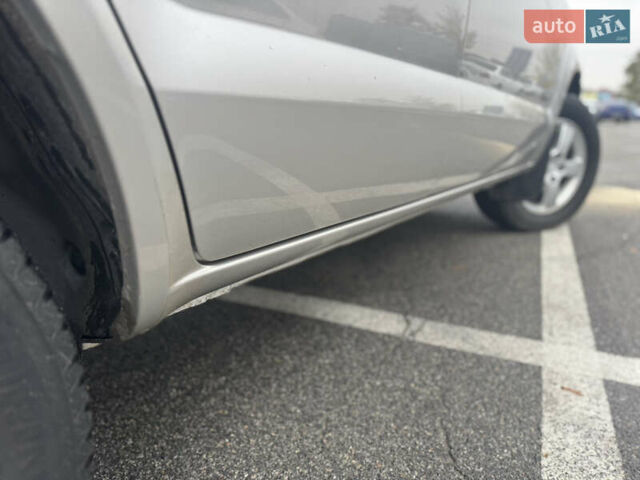 Серый Хендай Туксон, объемом двигателя 1.98 л и пробегом 175 тыс. км за 7800 $, фото 4 на Automoto.ua