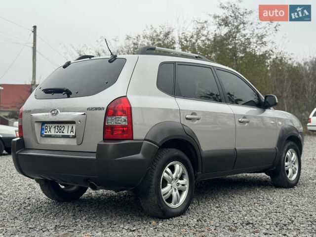 Серый Хендай Туксон, объемом двигателя 1.98 л и пробегом 241 тыс. км за 7000 $, фото 21 на Automoto.ua
