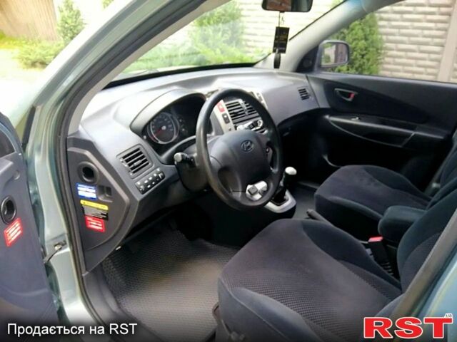 Серый Хендай Туксон, объемом двигателя 2 л и пробегом 179 тыс. км за 8500 $, фото 3 на Automoto.ua