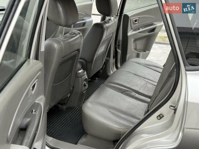 Серый Хендай Туксон, объемом двигателя 1.98 л и пробегом 252 тыс. км за 6950 $, фото 20 на Automoto.ua
