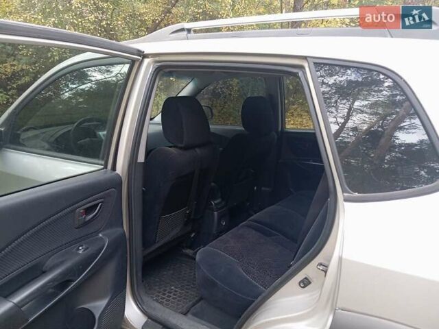 Серый Хендай Туксон, объемом двигателя 1.98 л и пробегом 312 тыс. км за 6000 $, фото 7 на Automoto.ua