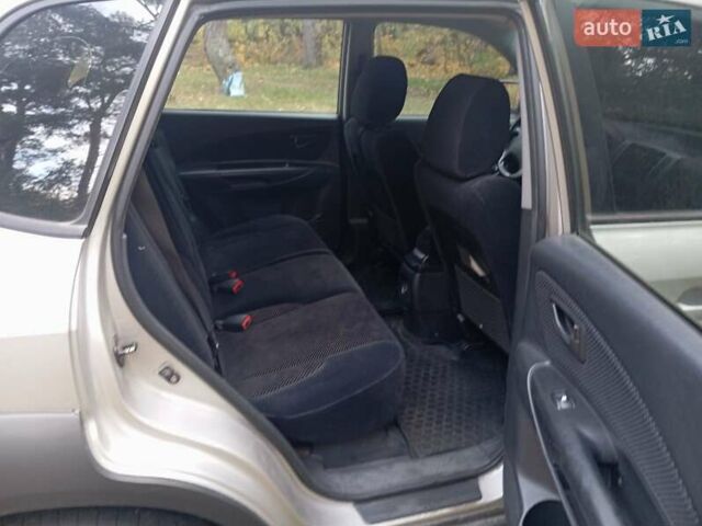 Серый Хендай Туксон, объемом двигателя 1.98 л и пробегом 312 тыс. км за 6000 $, фото 2 на Automoto.ua