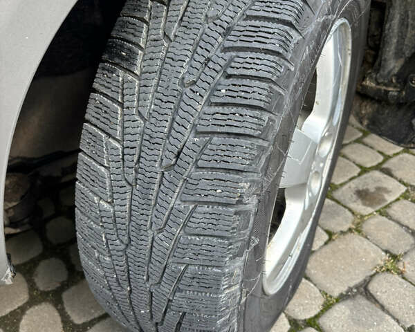 Сірий Хендай Туксон, об'ємом двигуна 1.99 л та пробігом 263 тис. км за 7600 $, фото 10 на Automoto.ua