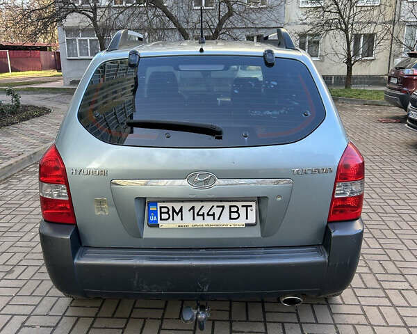 Серый Хендай Туксон, объемом двигателя 1.98 л и пробегом 269 тыс. км за 7500 $, фото 6 на Automoto.ua