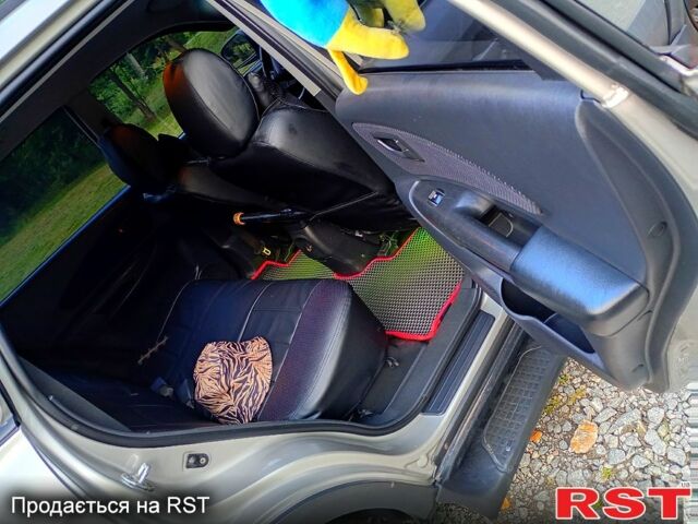 Сірий Хендай Туксон, об'ємом двигуна 2 л та пробігом 300 тис. км за 7500 $, фото 5 на Automoto.ua