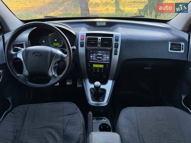 Серый Хендай Туксон, объемом двигателя 1.98 л и пробегом 282 тыс. км за 8350 $, фото 29 на Automoto.ua