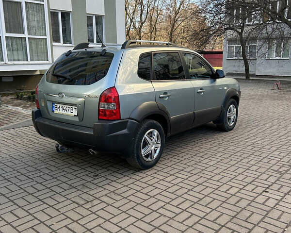 Серый Хендай Туксон, объемом двигателя 1.98 л и пробегом 269 тыс. км за 7500 $, фото 4 на Automoto.ua