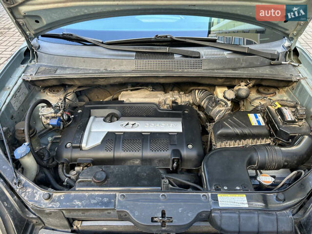 Серый Хендай Туксон, объемом двигателя 1.98 л и пробегом 269 тыс. км за 7500 $, фото 25 на Automoto.ua