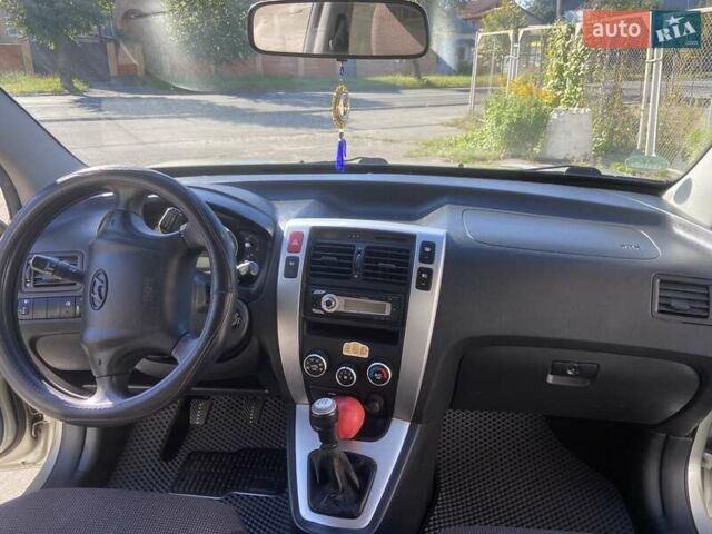 Сірий Хендай Туксон, об'ємом двигуна 1.98 л та пробігом 255 тис. км за 7350 $, фото 9 на Automoto.ua