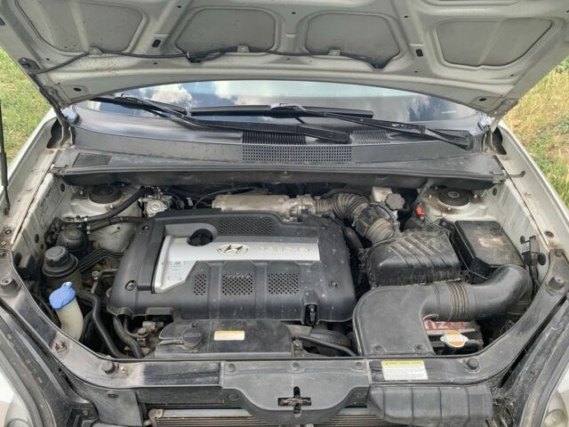 Серый Хендай Туксон, объемом двигателя 2 л и пробегом 228 тыс. км за 7400 $, фото 8 на Automoto.ua