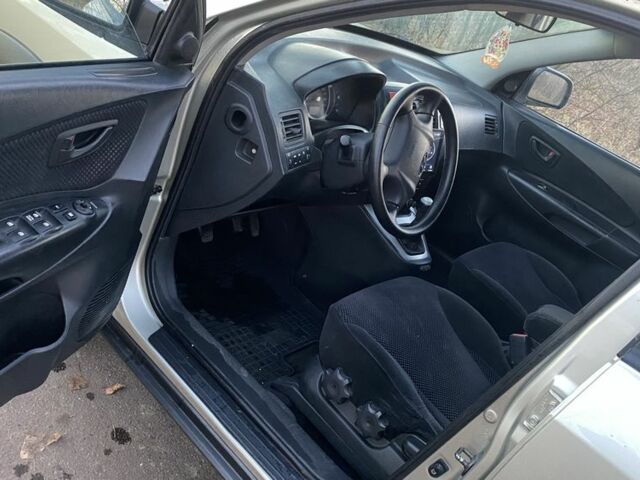 Серый Хендай Туксон, объемом двигателя 2 л и пробегом 345 тыс. км за 6700 $, фото 11 на Automoto.ua