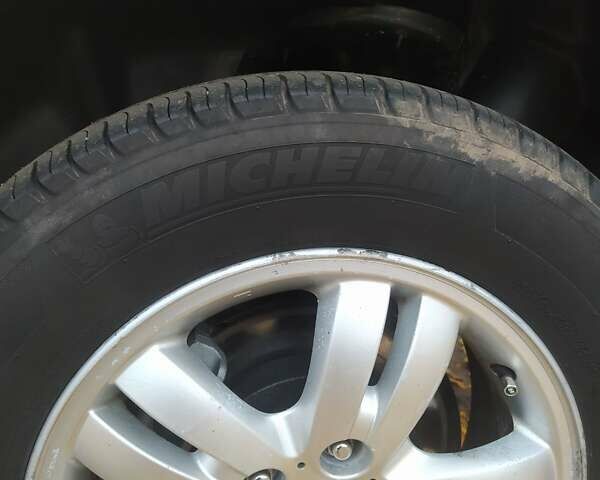 Серый Хендай Туксон, объемом двигателя 1.98 л и пробегом 250 тыс. км за 7300 $, фото 15 на Automoto.ua