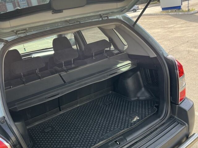 Сірий Хендай Туксон, об'ємом двигуна 2 л та пробігом 170 тис. км за 8700 $, фото 19 на Automoto.ua