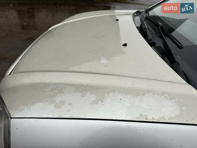 Серый Хендай Туксон, объемом двигателя 1.98 л и пробегом 340 тыс. км за 3999 $, фото 5 на Automoto.ua