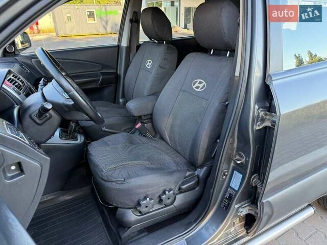 Серый Хендай Туксон, объемом двигателя 1.98 л и пробегом 282 тыс. км за 8350 $, фото 32 на Automoto.ua