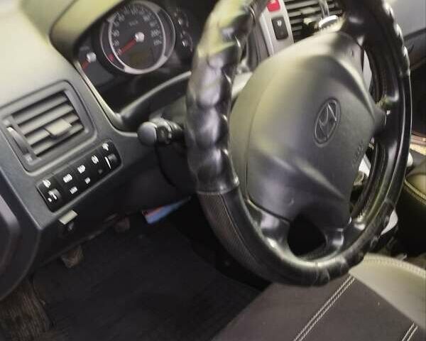 Сірий Хендай Туксон, об'ємом двигуна 1.98 л та пробігом 169 тис. км за 10500 $, фото 2 на Automoto.ua