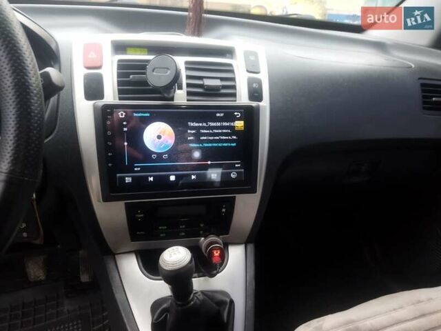 Серый Хендай Туксон, объемом двигателя 2 л и пробегом 210 тыс. км за 8200 $, фото 6 на Automoto.ua
