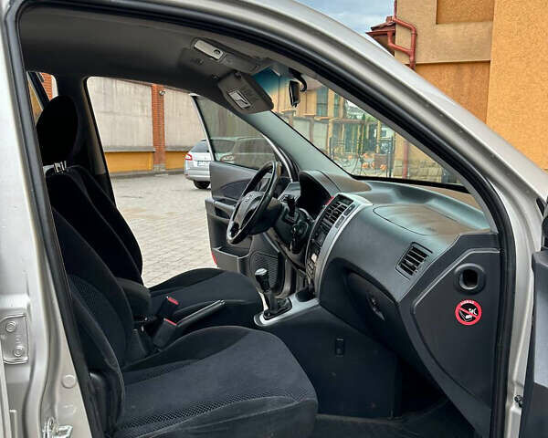 Серый Хендай Туксон, объемом двигателя 1.98 л и пробегом 225 тыс. км за 6299 $, фото 18 на Automoto.ua