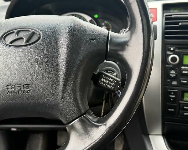 Сірий Хендай Туксон, об'ємом двигуна 2 л та пробігом 187 тис. км за 7700 $, фото 42 на Automoto.ua