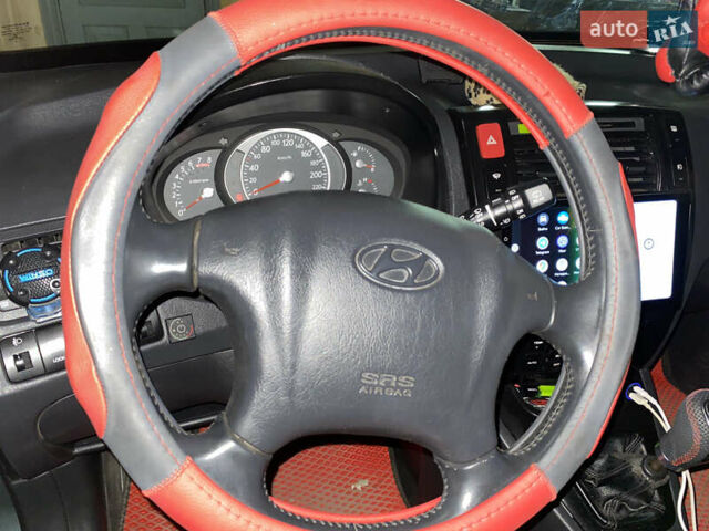 Сірий Хендай Туксон, об'ємом двигуна 2.02 л та пробігом 226 тис. км за 9200 $, фото 5 на Automoto.ua