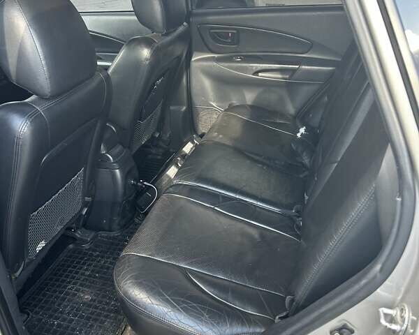 Сірий Хендай Туксон, об'ємом двигуна 1.98 л та пробігом 413 тис. км за 7300 $, фото 7 на Automoto.ua