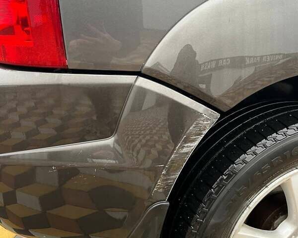 Серый Хендай Туксон, объемом двигателя 1.98 л и пробегом 254 тыс. км за 6900 $, фото 6 на Automoto.ua