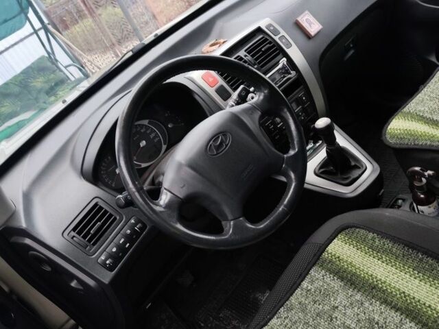 Серый Хендай Туксон, объемом двигателя 2 л и пробегом 190 тыс. км за 9000 $, фото 12 на Automoto.ua