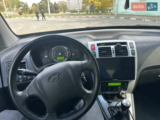 Серый Хендай Туксон, объемом двигателя 2 л и пробегом 201 тыс. км за 8300 $, фото 7 на Automoto.ua