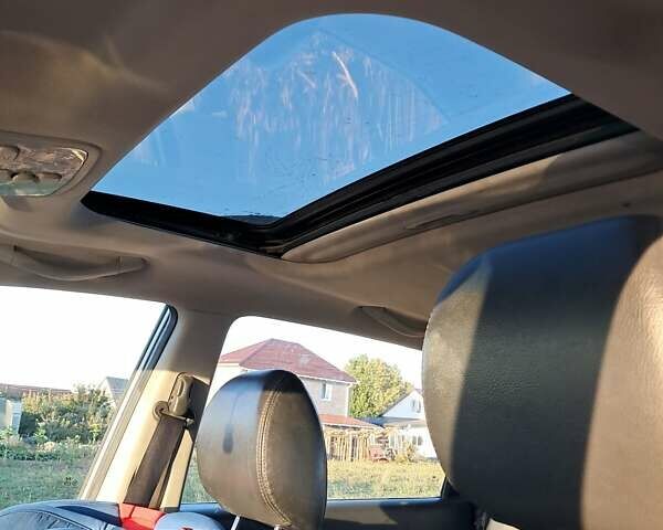 Серый Хендай Туксон, объемом двигателя 2.66 л и пробегом 244 тыс. км за 7400 $, фото 3 на Automoto.ua