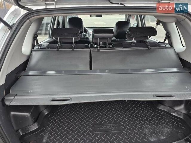 Серый Хендай Туксон, объемом двигателя 1.98 л и пробегом 189 тыс. км за 8300 $, фото 13 на Automoto.ua