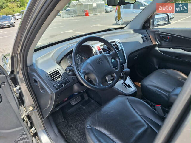 Серый Хендай Туксон, объемом двигателя 1.98 л и пробегом 228 тыс. км за 8700 $, фото 10 на Automoto.ua