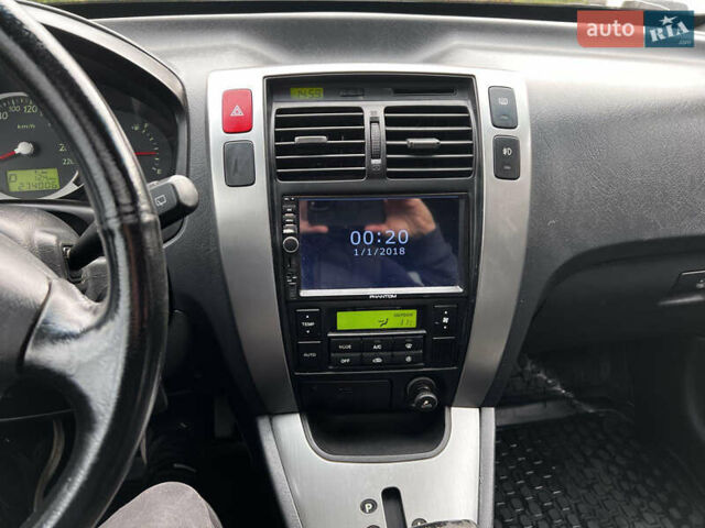 Серый Хендай Туксон, объемом двигателя 1.98 л и пробегом 274 тыс. км за 7700 $, фото 11 на Automoto.ua