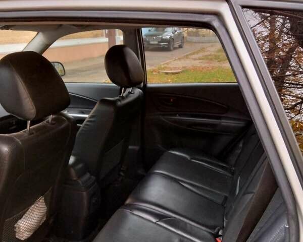 Сірий Хендай Туксон, об'ємом двигуна 2 л та пробігом 225 тис. км за 8700 $, фото 10 на Automoto.ua