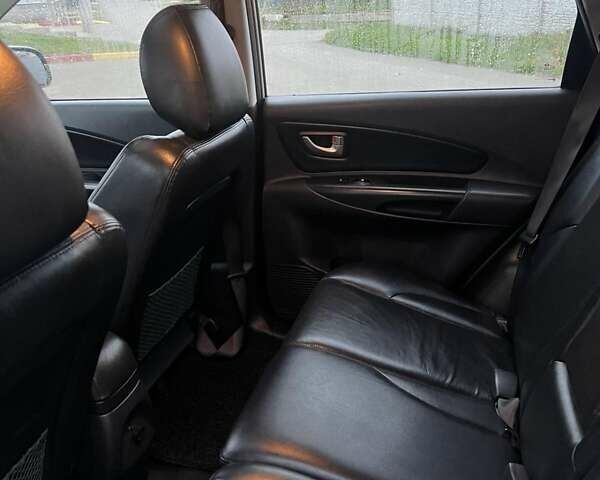 Серый Хендай Туксон, объемом двигателя 1.99 л и пробегом 132 тыс. км за 10000 $, фото 19 на Automoto.ua