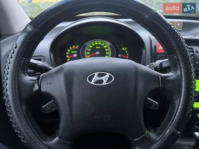 Серый Хендай Туксон, объемом двигателя 1.99 л и пробегом 132 тыс. км за 10000 $, фото 11 на Automoto.ua