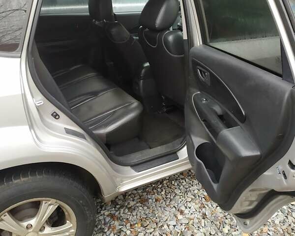 Серый Хендай Туксон, объемом двигателя 2 л и пробегом 228 тыс. км за 8200 $, фото 6 на Automoto.ua