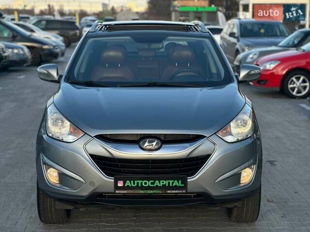 Серый Хендай Туксон, объемом двигателя 2.36 л и пробегом 150 тыс. км за 12990 $, фото 4 на Automoto.ua