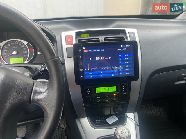 Сірий Хендай Туксон, об'ємом двигуна 1.98 л та пробігом 183 тис. км за 8350 $, фото 10 на Automoto.ua