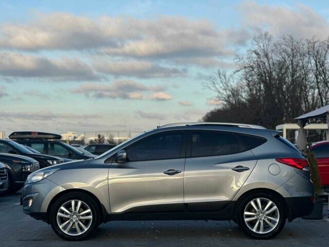 Серый Хендай Туксон, объемом двигателя 2.4 л и пробегом 150 тыс. км за 12990 $, фото 5 на Automoto.ua