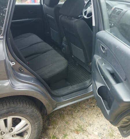 Сірий Хендай Туксон, об'ємом двигуна 2 л та пробігом 59 тис. км за 10400 $, фото 6 на Automoto.ua