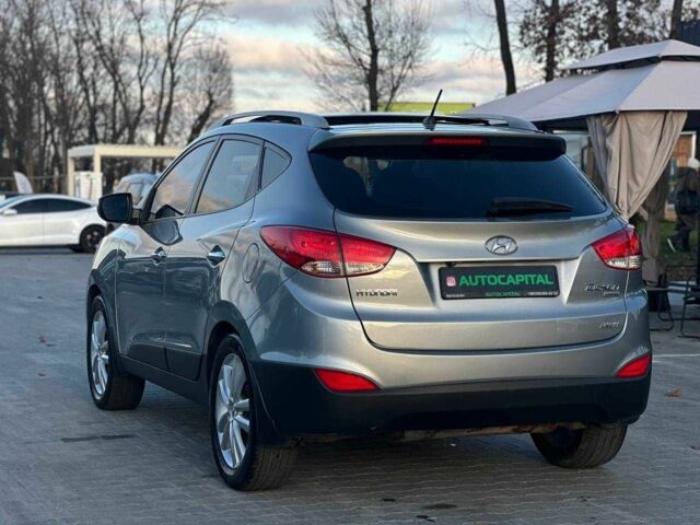 Серый Хендай Туксон, объемом двигателя 2.4 л и пробегом 150 тыс. км за 12990 $, фото 4 на Automoto.ua