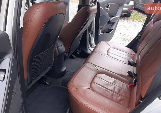 Серый Хендай Туксон, объемом двигателя 2.4 л и пробегом 115 тыс. км за 11200 $, фото 2 на Automoto.ua