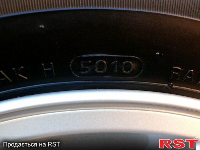 Серый Хендай Туксон, объемом двигателя 2 л и пробегом 370 тыс. км за 13300 $, фото 8 на Automoto.ua