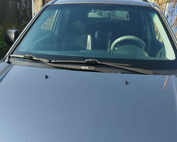 Серый Хендай Туксон, объемом двигателя 2 л и пробегом 168 тыс. км за 9499 $, фото 4 на Automoto.ua