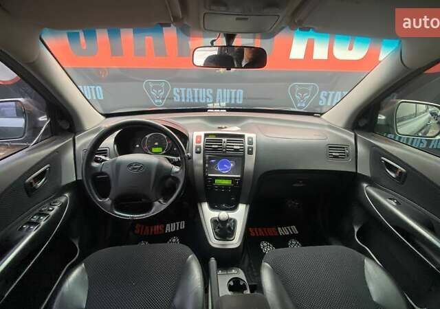 Серый Хендай Туксон, объемом двигателя 1.98 л и пробегом 174 тыс. км за 9500 $, фото 27 на Automoto.ua