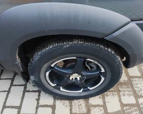 Серый Хендай Туксон, объемом двигателя 2 л и пробегом 255 тыс. км за 9500 $, фото 7 на Automoto.ua