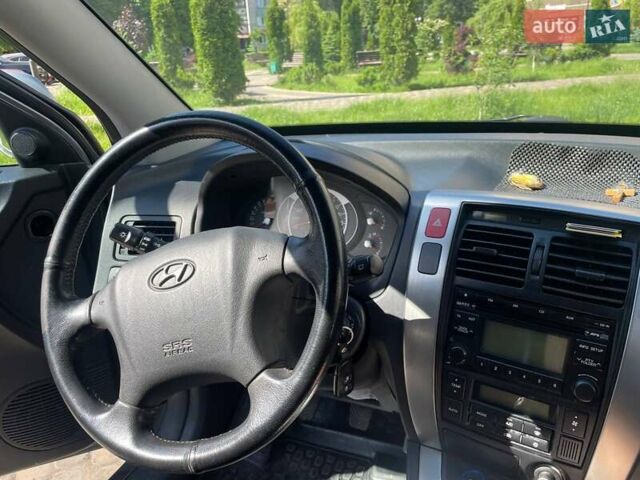 Сірий Хендай Туксон, об'ємом двигуна 1.98 л та пробігом 91 тис. км за 10200 $, фото 7 на Automoto.ua