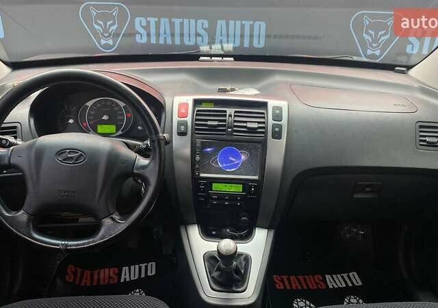 Серый Хендай Туксон, объемом двигателя 1.98 л и пробегом 174 тыс. км за 9500 $, фото 26 на Automoto.ua