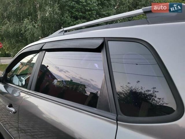 Сірий Хендай Туксон, об'ємом двигуна 2 л та пробігом 139 тис. км за 9888 $, фото 51 на Automoto.ua