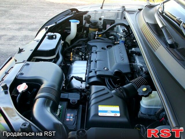 Серый Хендай Туксон, объемом двигателя 2 л и пробегом 370 тыс. км за 13300 $, фото 4 на Automoto.ua